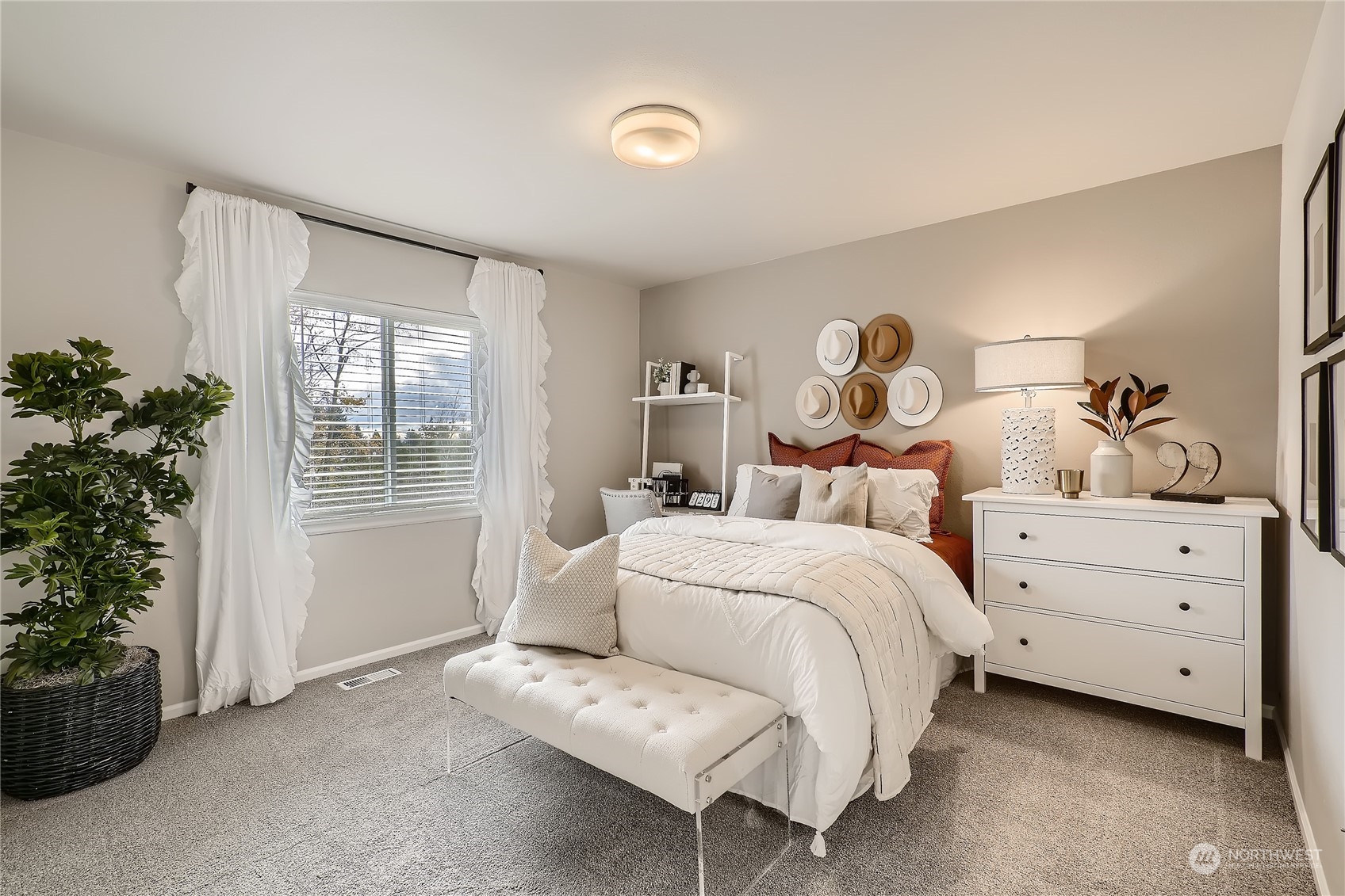 21120 42nd Drive Southeast, Unit 124 Bothell, WA 98021 - Photo 7 of 23 a bed room with a bed and a window