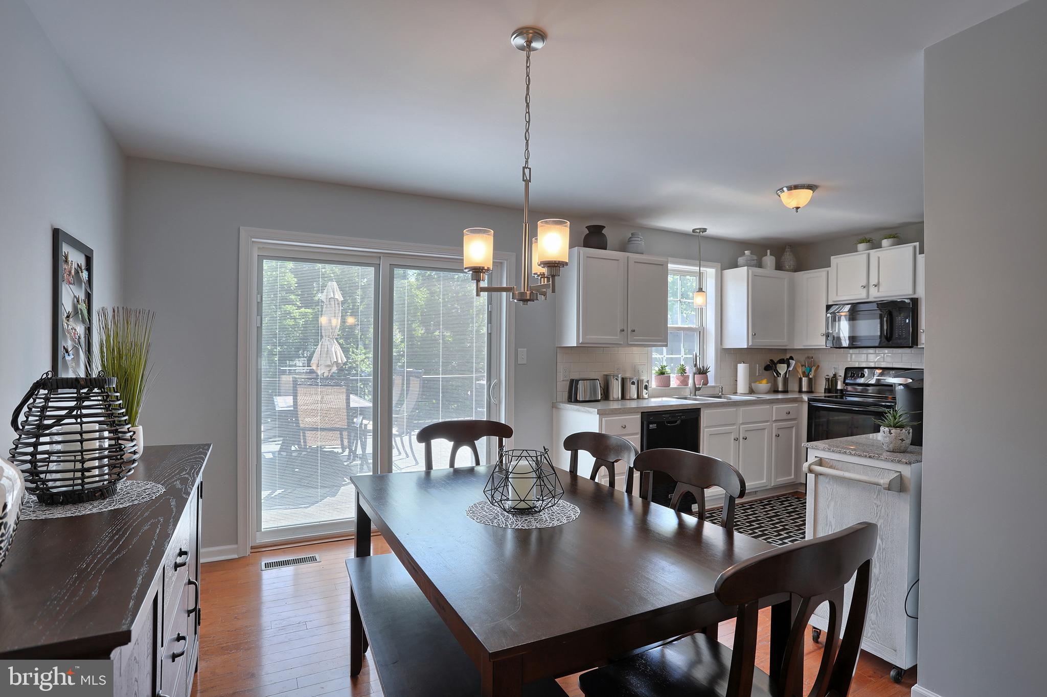 165 Riders Way Lebanon, PA 17042 - Photo 8 of 34 Dining Room with Updated Sliders to Deck