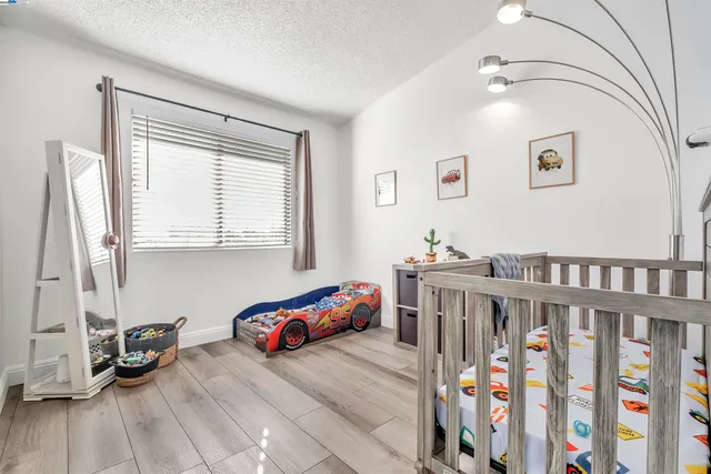 a bedroom with furniture and a window