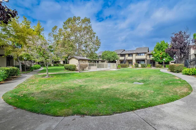 a view of a house with a yard porch and sitting area