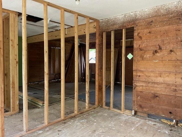 515 East Murray Street Denison, TX 75021 - Photo 15 of 22 Miscellaneous room featuring wooden walls