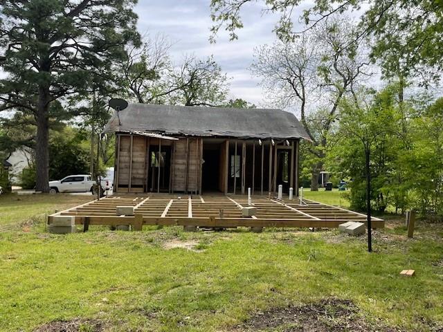 515 East Murray Street Denison, TX 75021 - Photo 6 of 22 Back of property with a yard