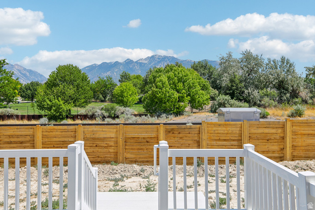 11781 South Halls Crk Road Draper, UT 84020 - Photo 30 of 33 White deck railings overlooking a wooden privacy fence