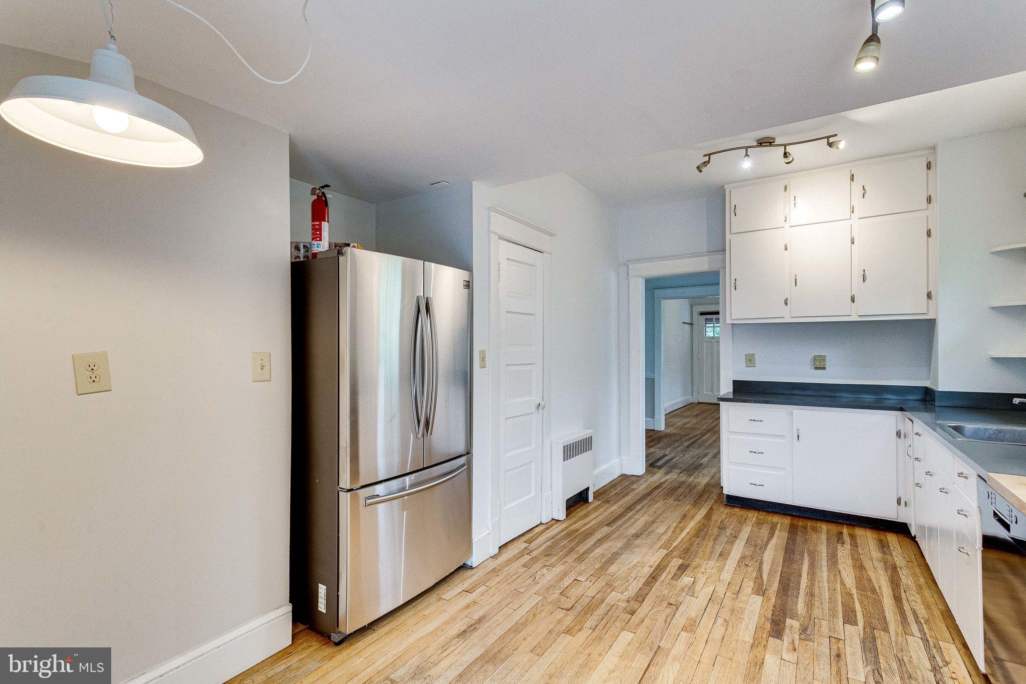 721 Boundary Avenue Silver Spring, MD 20910 - Photo 8 of 17 Open kitchen with hardwood floors