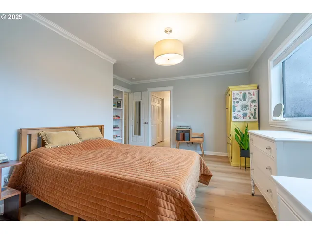 a bedroom with a bed and a dresser