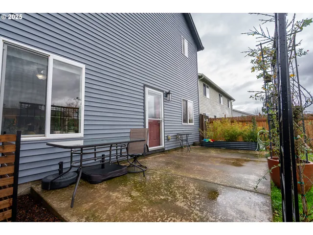 a view of a backyard with a sitting area