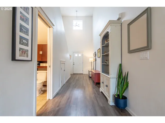 a hall with furniture and wooden floor