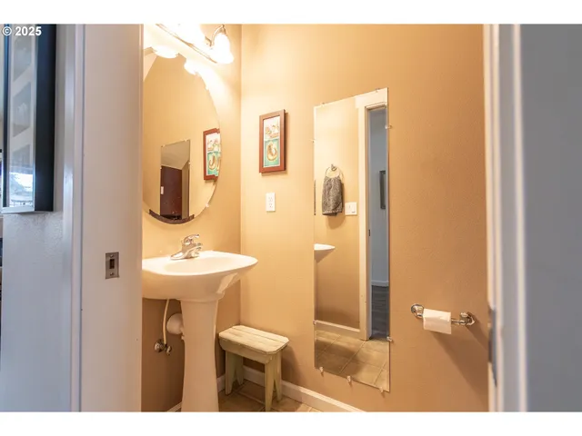 a bathroom with a sink a mirror and a toilet