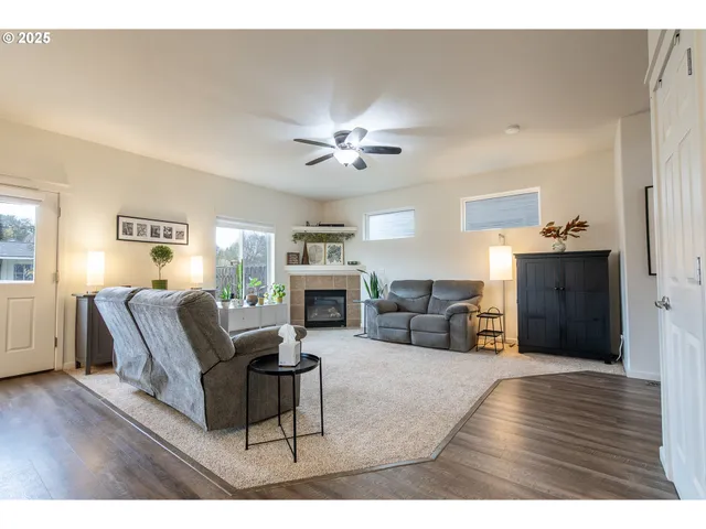 a living room with furniture and a fireplace