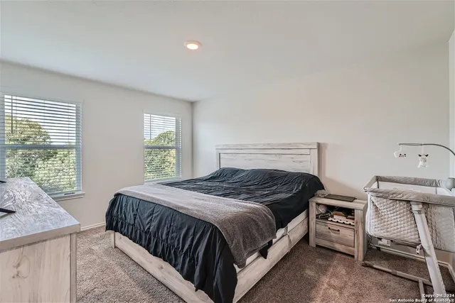 a white toilet sitting next to a bathroom sink