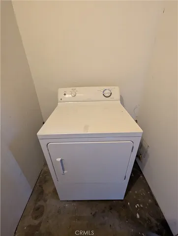 a view of a pathway of a wooden fence