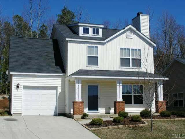 3717 Satinleaf Drive Raleigh, NC 27616 - Photo 1 of 12 a front view of a house with a yard