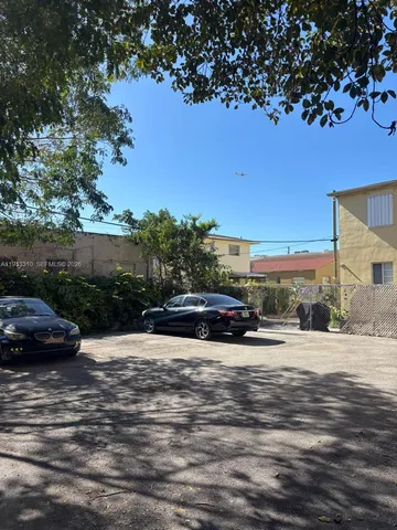 a view of street with parked cars
