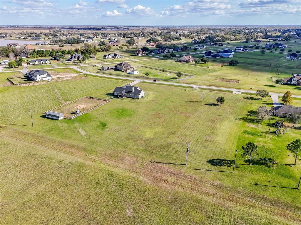702 Comanche Trail Drive Rosharon, TX 77583 - Photo 19 of 24 a view of a swimming pool and an ocean view