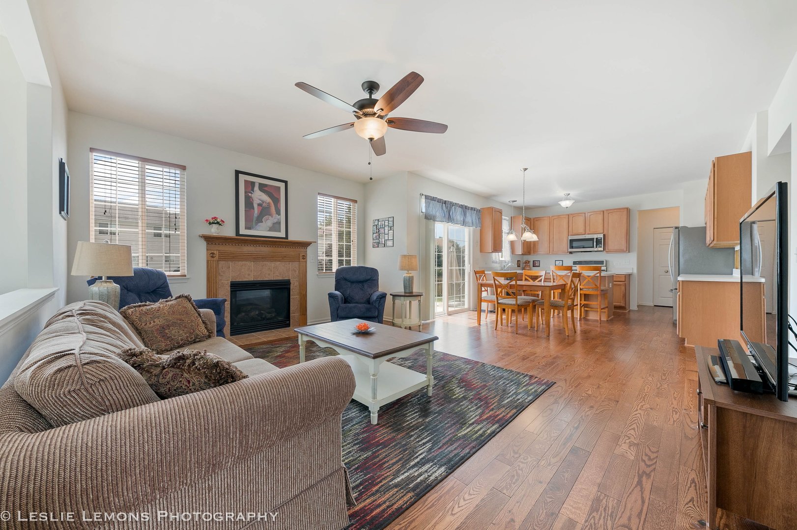3027 Patterson Road Montgomery, IL 60538 - Photo 15 of 32 a living room with furniture fireplace and a flat screen tv