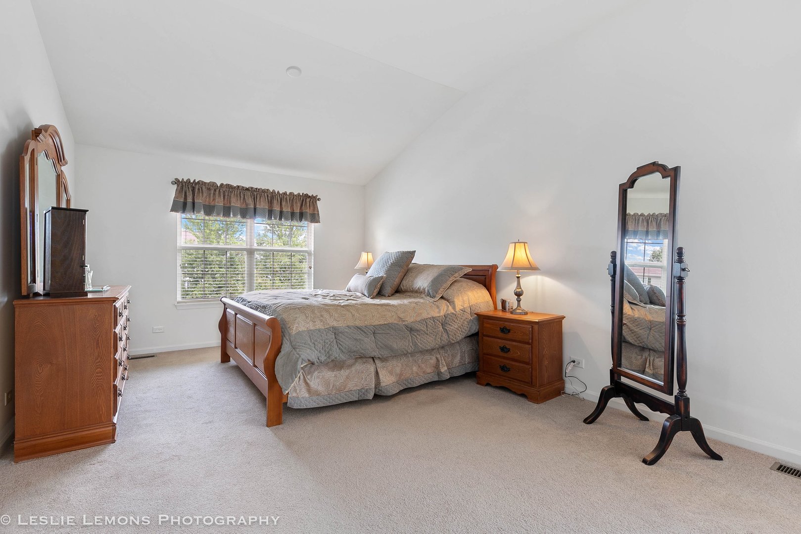 3027 Patterson Road Montgomery, IL 60538 - Photo 20 of 32 a spacious bedroom with a bed and a window