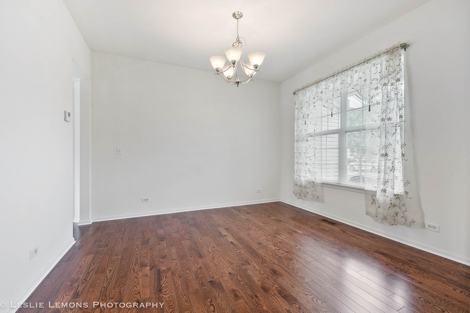 3027 Patterson Road Montgomery, IL 60538 - Photo 5 of 32 wooden floor in an empty room with a window