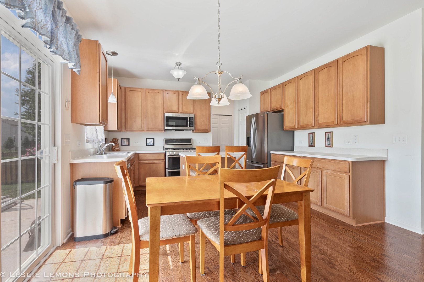 3027 Patterson Road Montgomery, IL 60538 - Photo 9 of 32 a view of a dining room with furniture and wooden floor