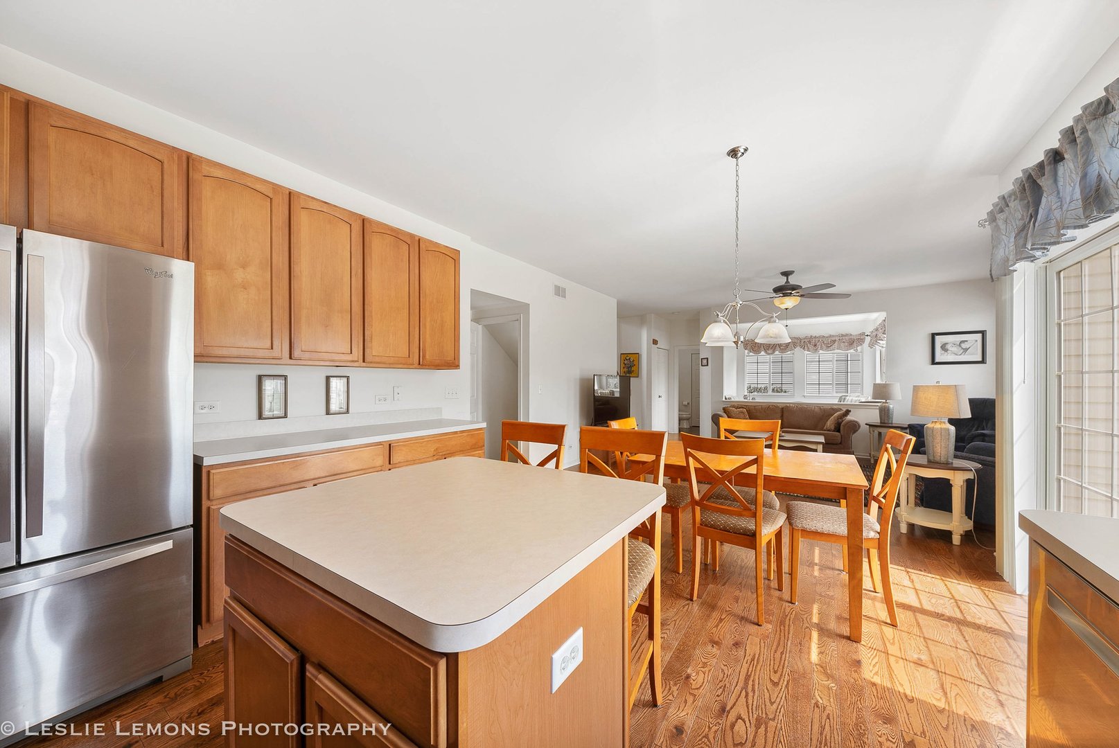 3027 Patterson Road Montgomery, IL 60538 - Photo 10 of 32 a kitchen with stainless steel appliances a table chairs and a refrigerator