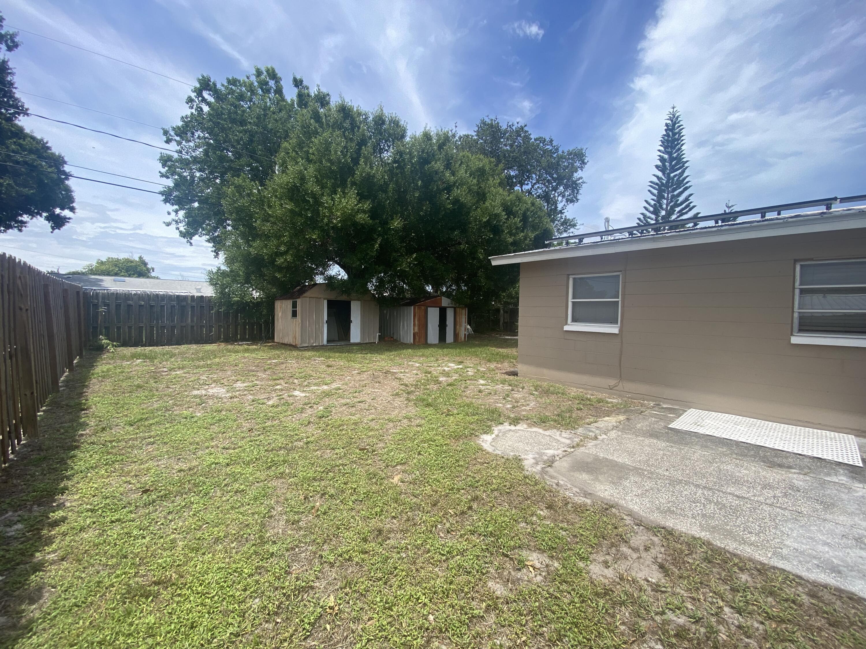 2544 Coventry Road Melbourne, FL 32935 - Photo 14 of 16 a view of a backyard