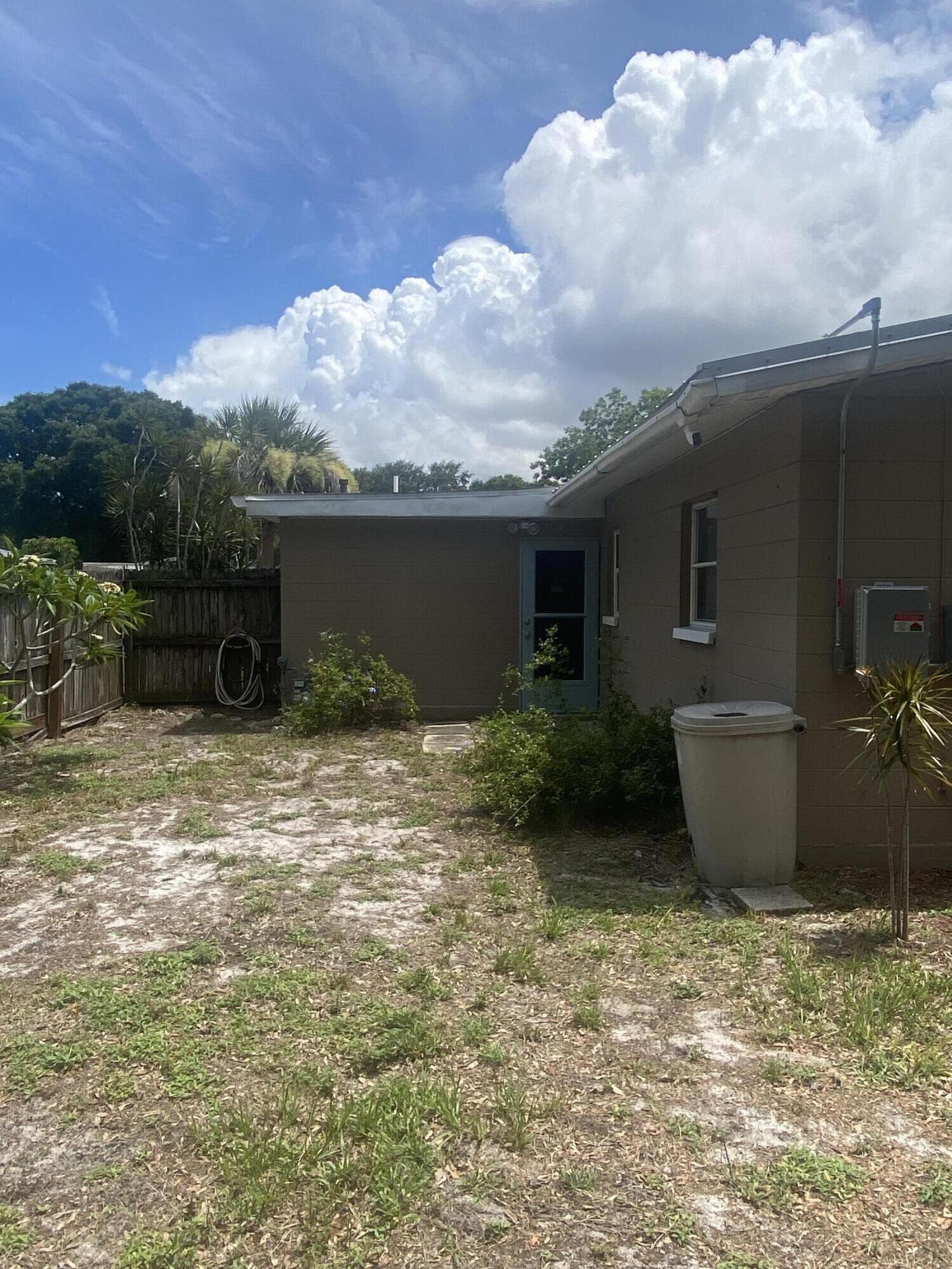 2544 Coventry Road Melbourne, FL 32935 - Photo 15 of 16 a backyard of a house with table and chairs