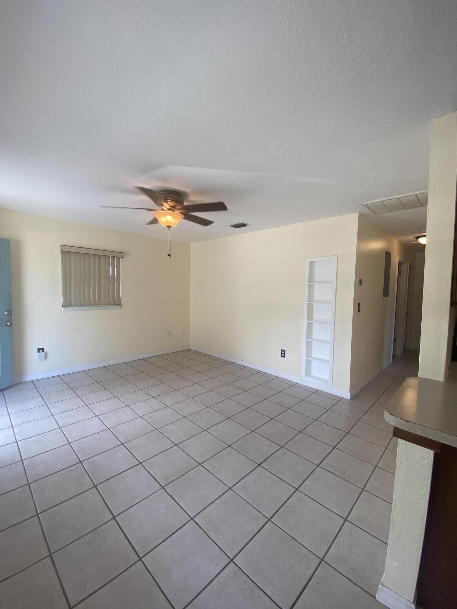 2544 Coventry Road Melbourne, FL 32935 - Photo 5 of 16 a view of a livingroom with natural light