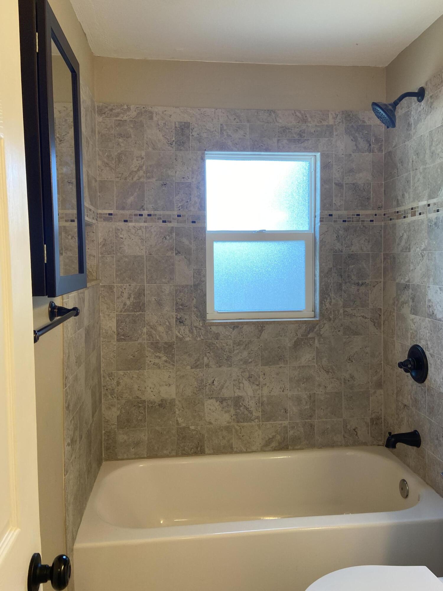 2544 Coventry Road Melbourne, FL 32935 - Photo 8 of 16 a bathroom with a bathtub