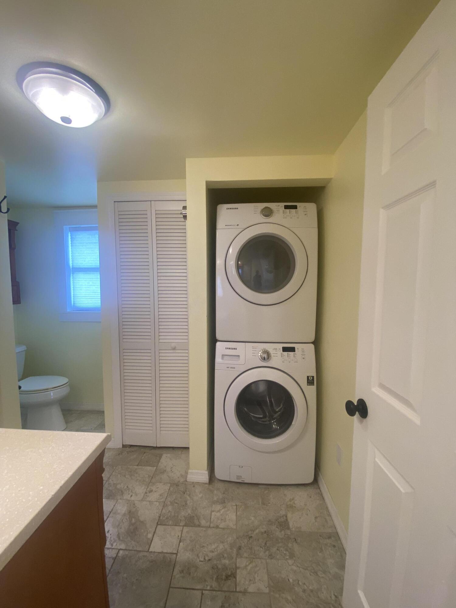 2544 Coventry Road Melbourne, FL 32935 - Photo 10 of 16 a utility room with dryer and washer