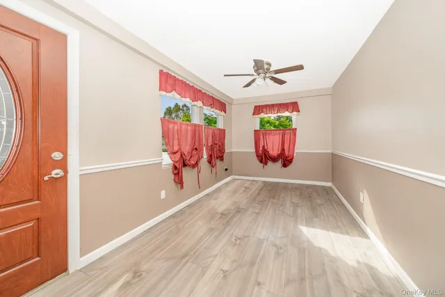 a view of entryway with wooden floor
