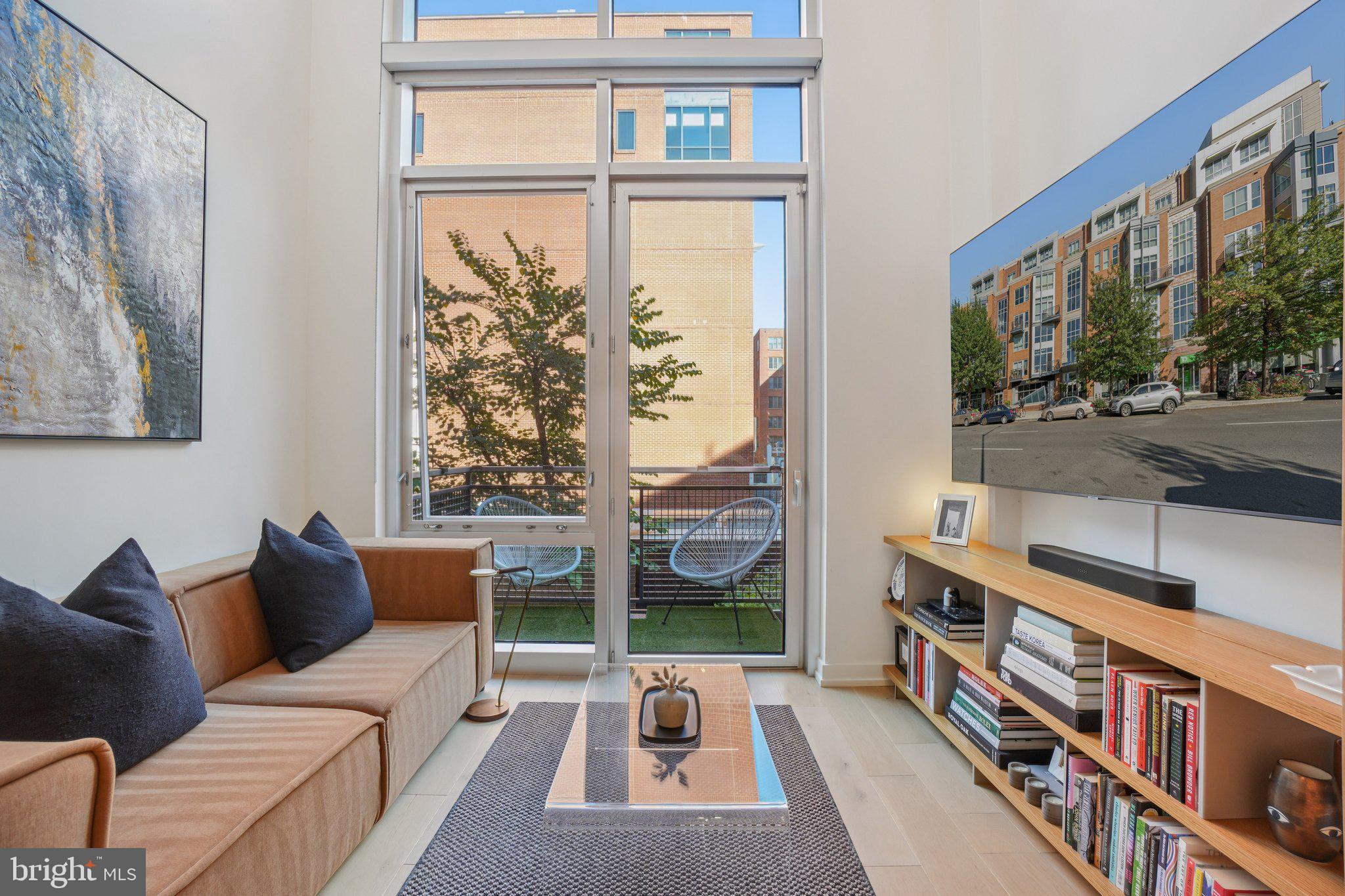 1515 15th Street Northwest, Unit 206 Washington, DC 20005 - Photo 1 of 32 a living room with furniture and a window