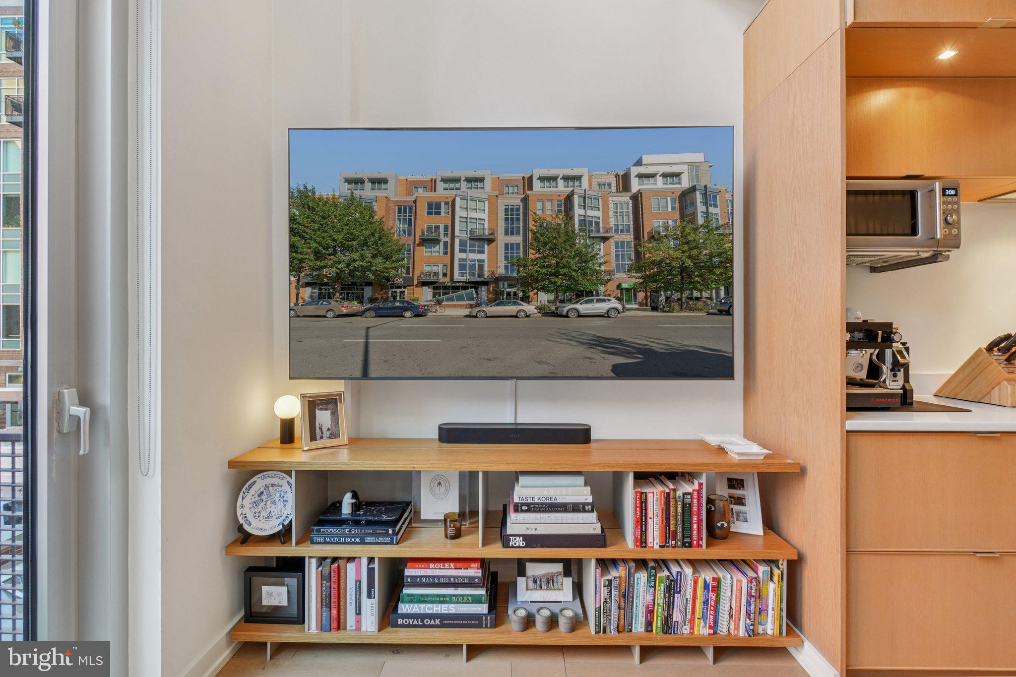 1515 15th Street Northwest, Unit 206 Washington, DC 20005 - Photo 11 of 32 a room with lots of books and a large window
