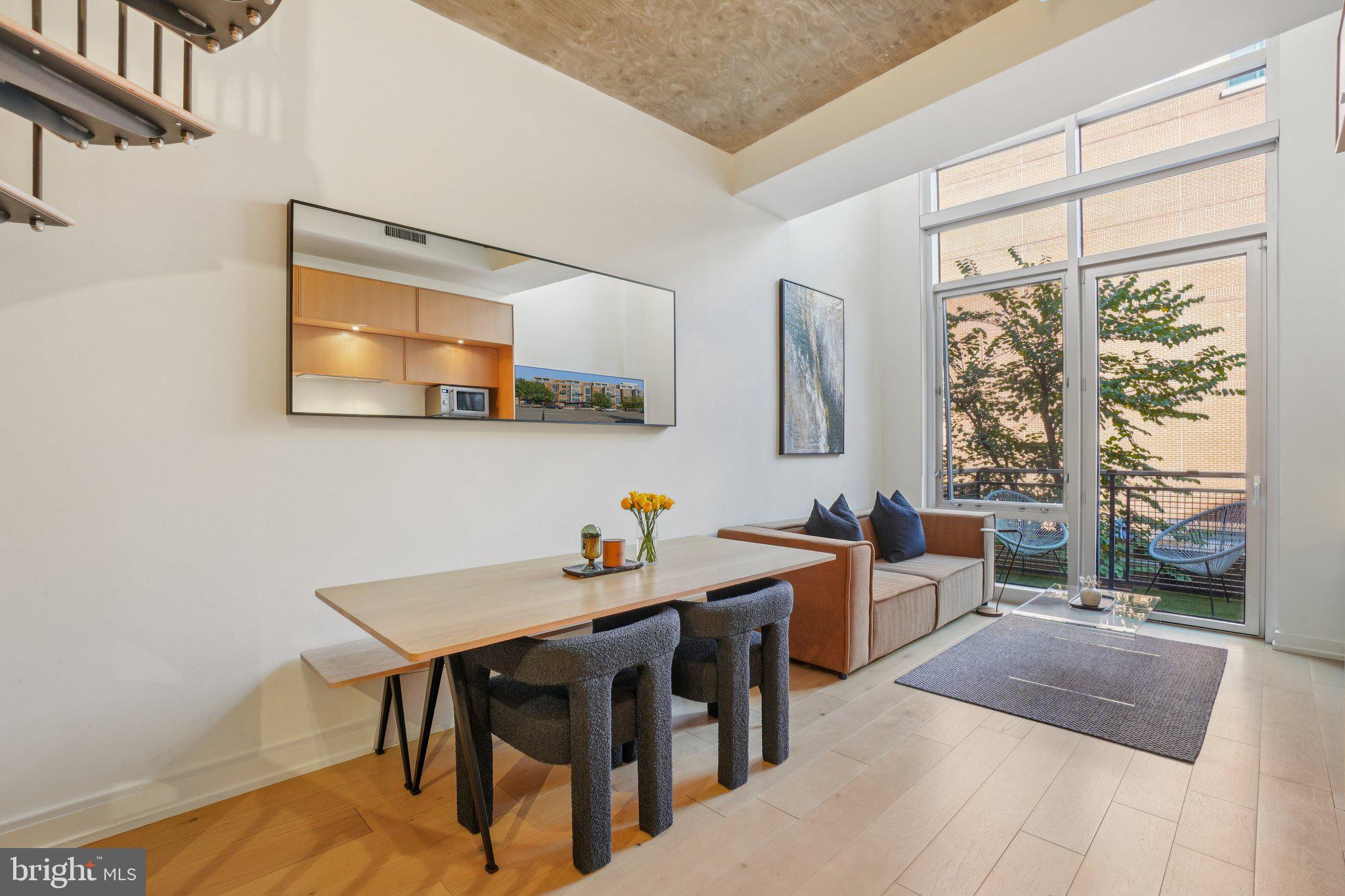 1515 15th Street Northwest, Unit 206 Washington, DC 20005 - Photo 2 of 32 a view of a dining room with furniture and a window