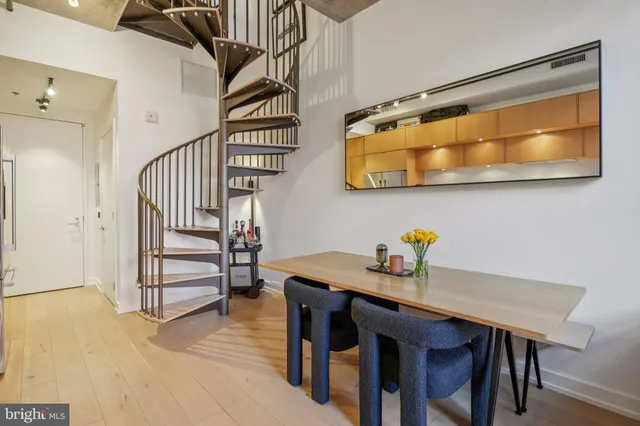 a view of a room that has a table and chairs in it