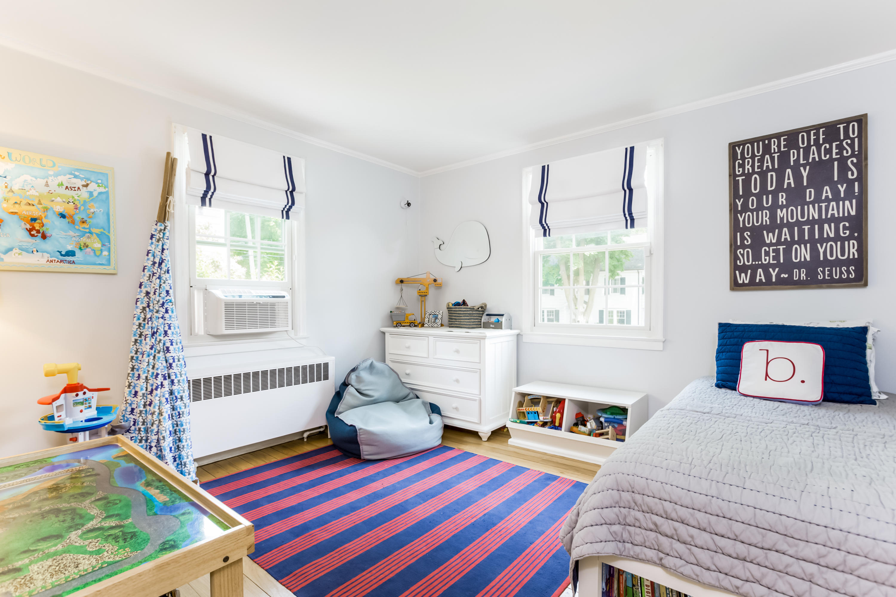 82 Linden Avenue Darien, CT 06820 - Photo 17 of 28 a bedroom with a bed and wooden floor