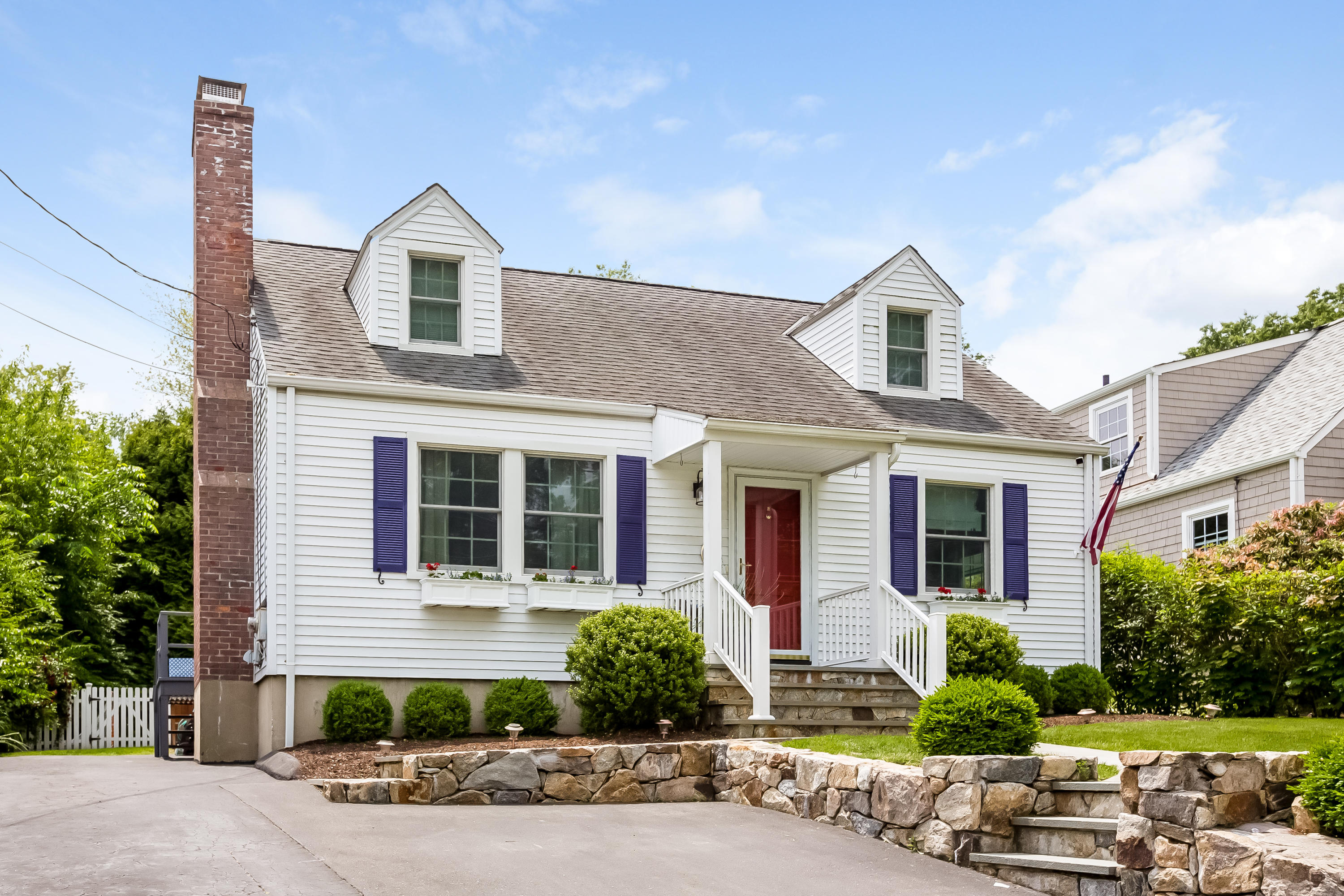 82 Linden Avenue Darien, CT 06820 - Photo 3 of 28 a front view of a house with a yard