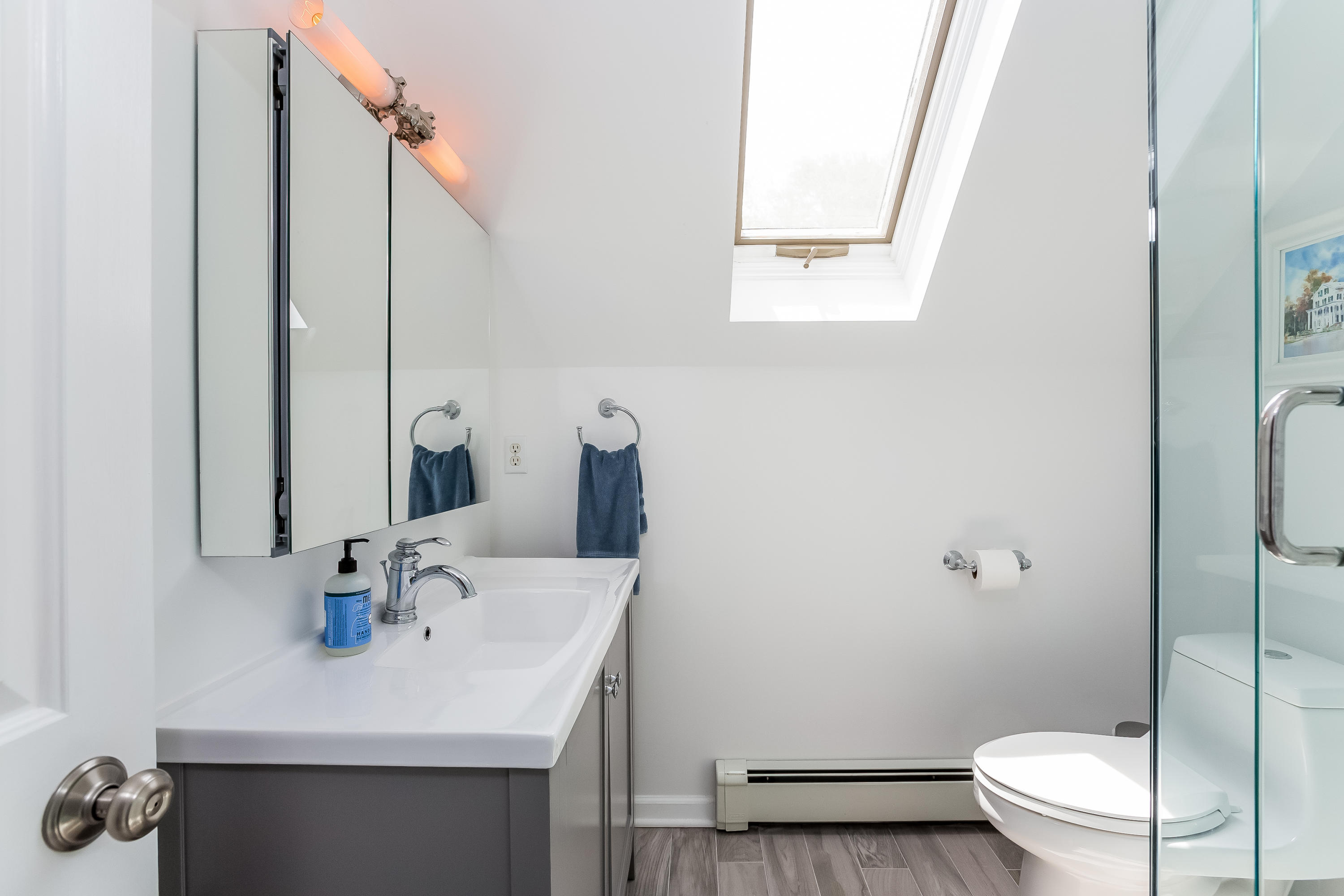 82 Linden Avenue Darien, CT 06820 - Photo 21 of 28 a bathroom with a sink a toilet and shower