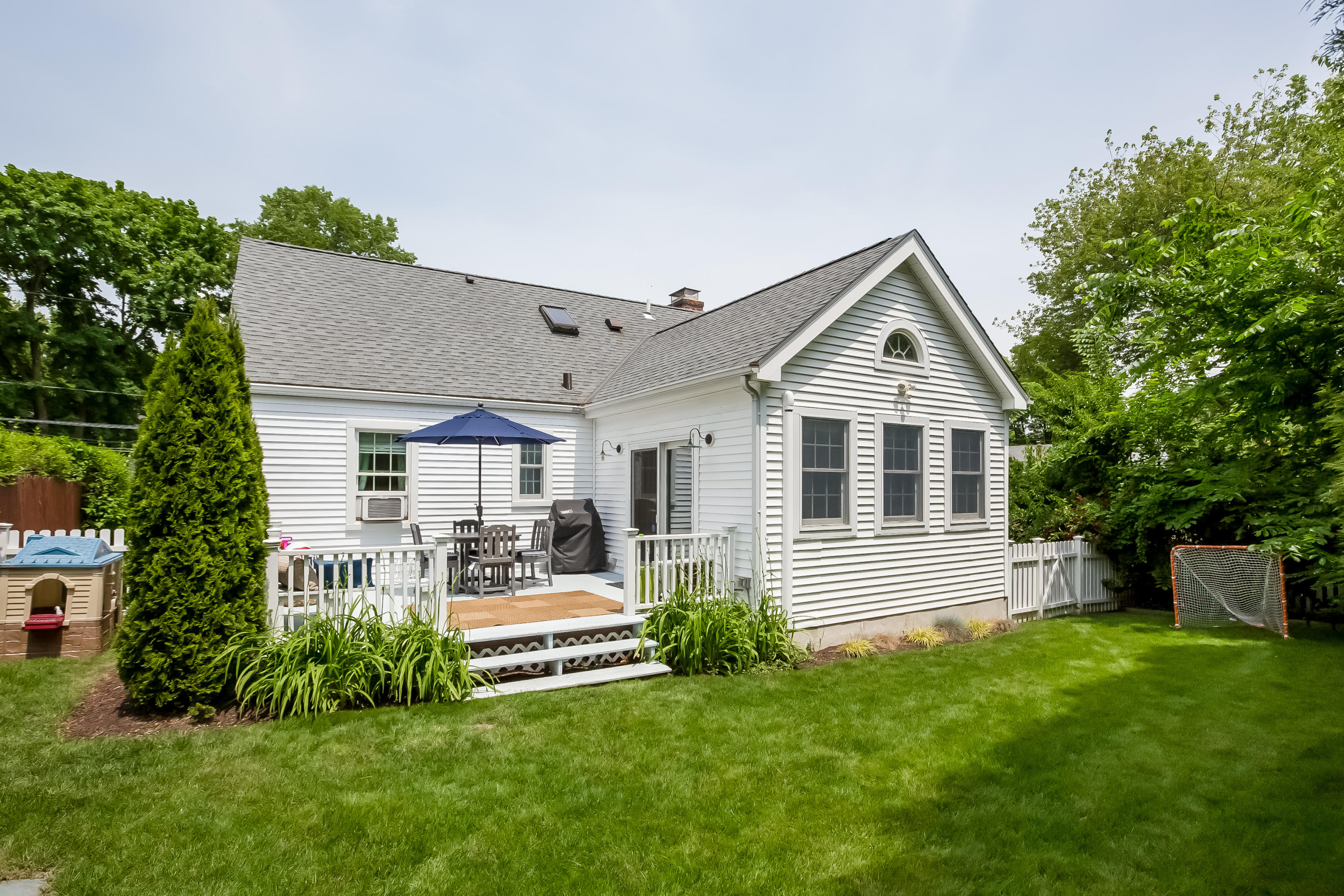 82 Linden Avenue Darien, CT 06820 - Photo 25 of 28 a front view of a house with a garden