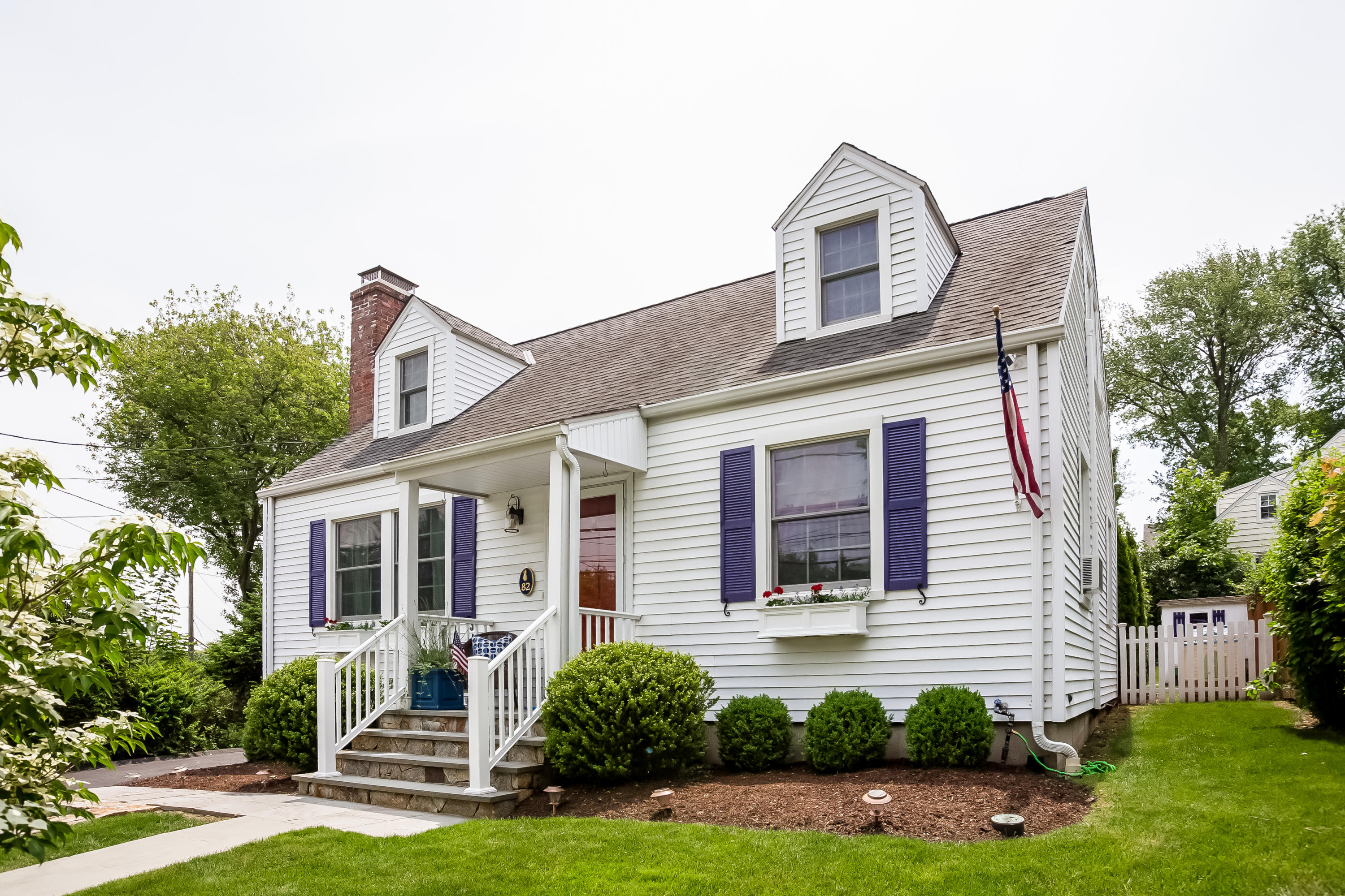82 Linden Avenue Darien, CT 06820 - Photo 4 of 28 a front view of a house with garden