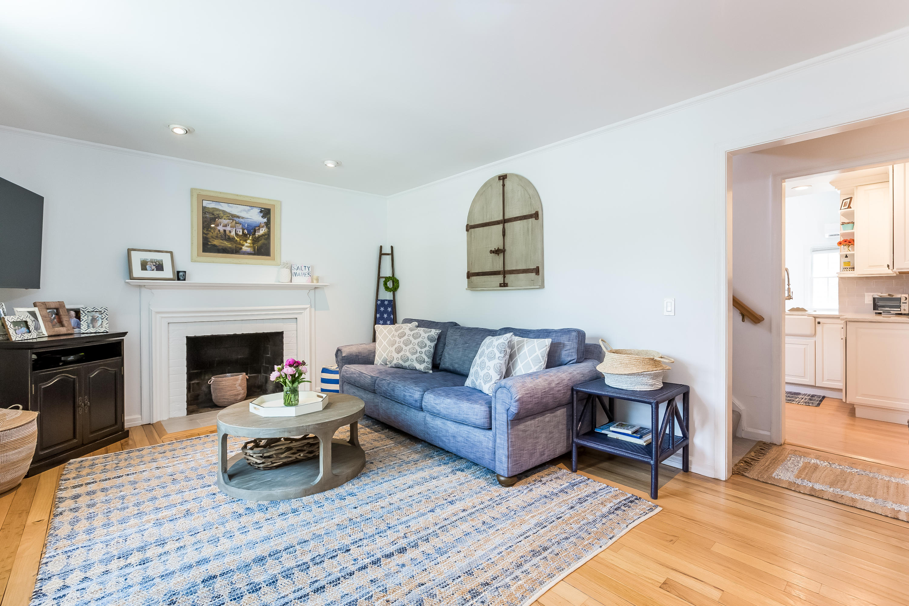 82 Linden Avenue Darien, CT 06820 - Photo 6 of 28 a living room with furniture and a fireplace