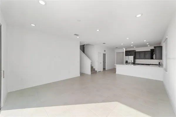 a view of kitchen and kitchen with a sink
