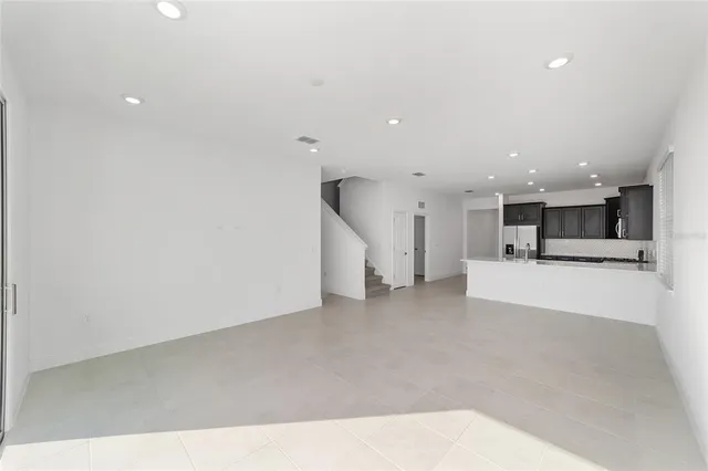 a view of kitchen and kitchen with a sink