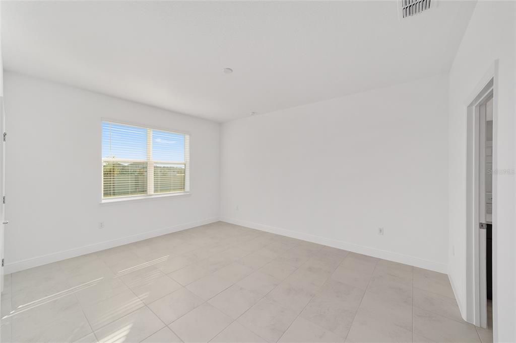 7276 Southwest 58th Place Road Ocala, FL 34474 - Photo 24 of 44 an empty room with a window