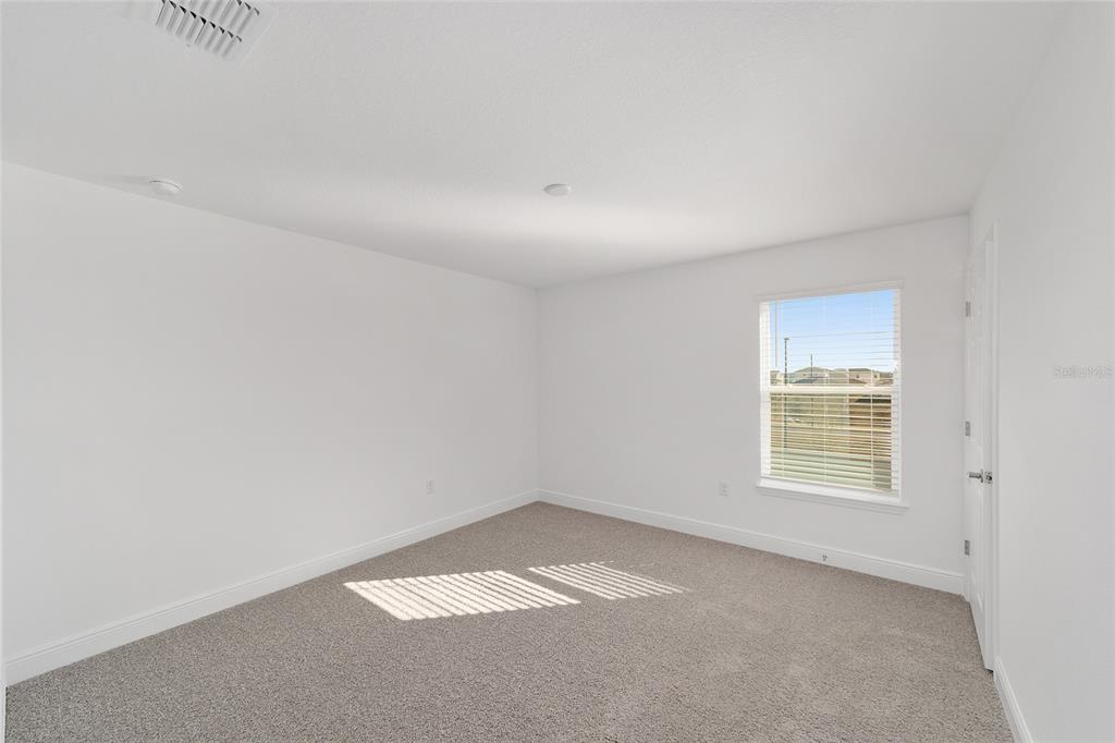 7276 Southwest 58th Place Road Ocala, FL 34474 - Photo 32 of 44 a view of an empty room with a window