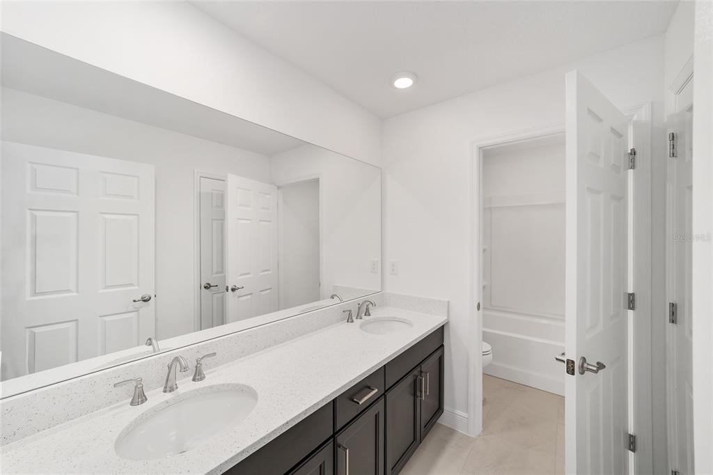 7276 Southwest 58th Place Road Ocala, FL 34474 - Photo 34 of 44 a bathroom with a sink and a mirror
