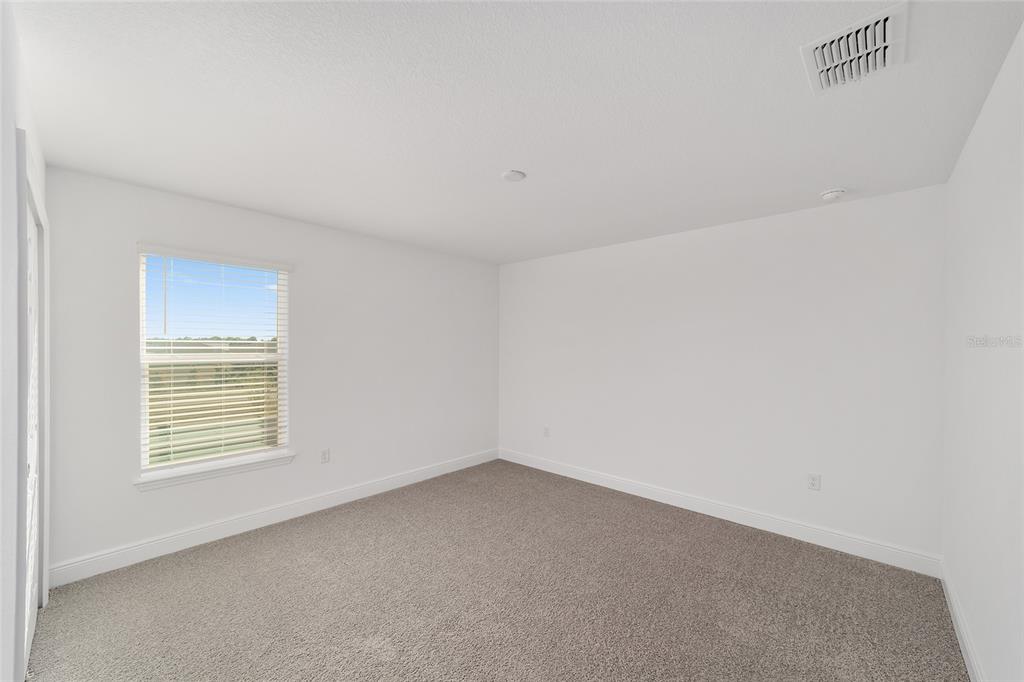 7276 Southwest 58th Place Road Ocala, FL 34474 - Photo 35 of 44 an empty room with a window