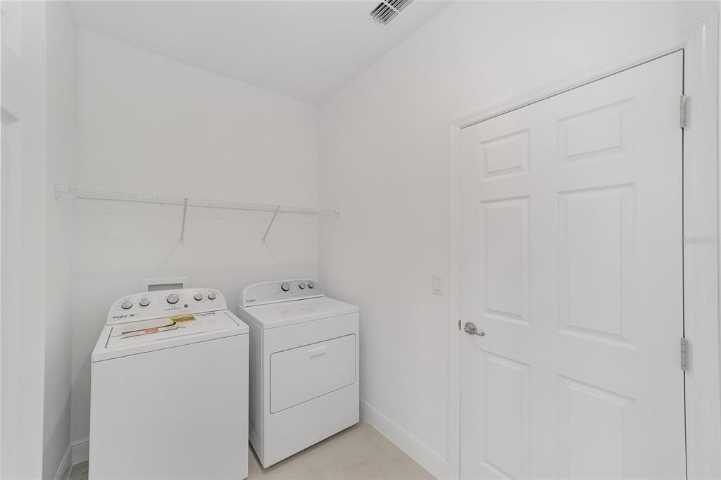 7276 Southwest 58th Place Road Ocala, FL 34474 - Photo 39 of 44 a utility room with dryer and washer