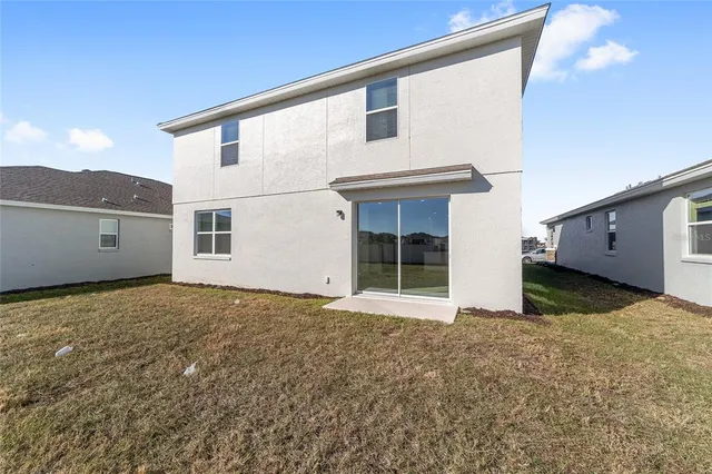 a house view with a big yard