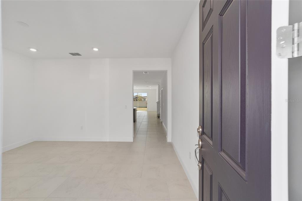 7276 Southwest 58th Place Road Ocala, FL 34474 - Photo 9 of 44 a view of a hallway with wooden shelves