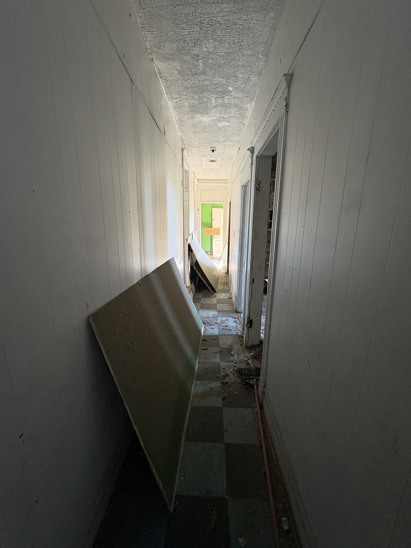 318 West 75th Street Chicago, IL 60621 - Photo 13 of 20 a view of entryway with wooden floor and a window