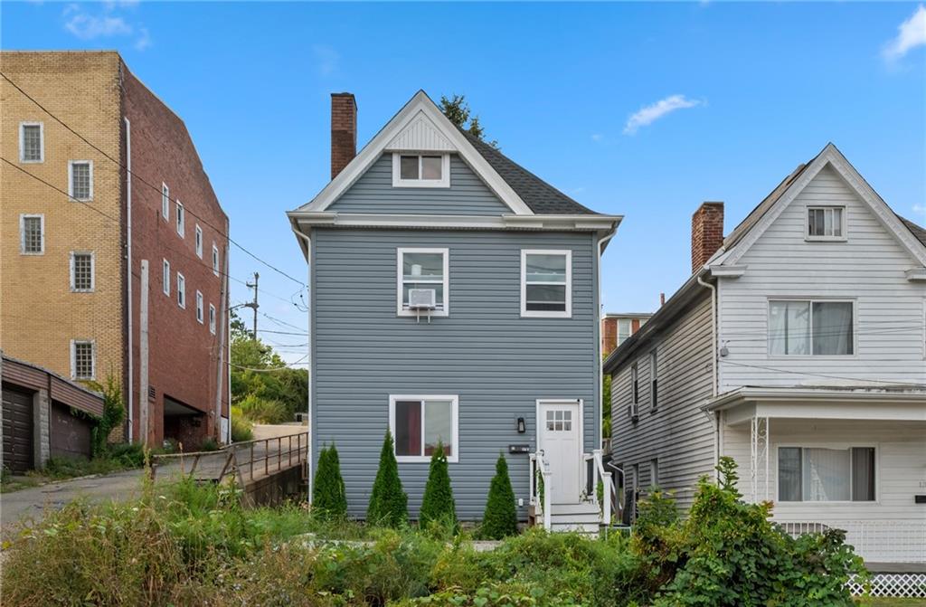 11 Maytide Street Pittsburgh, PA 15227 - Photo 3 of 8 a front view of a house with plants